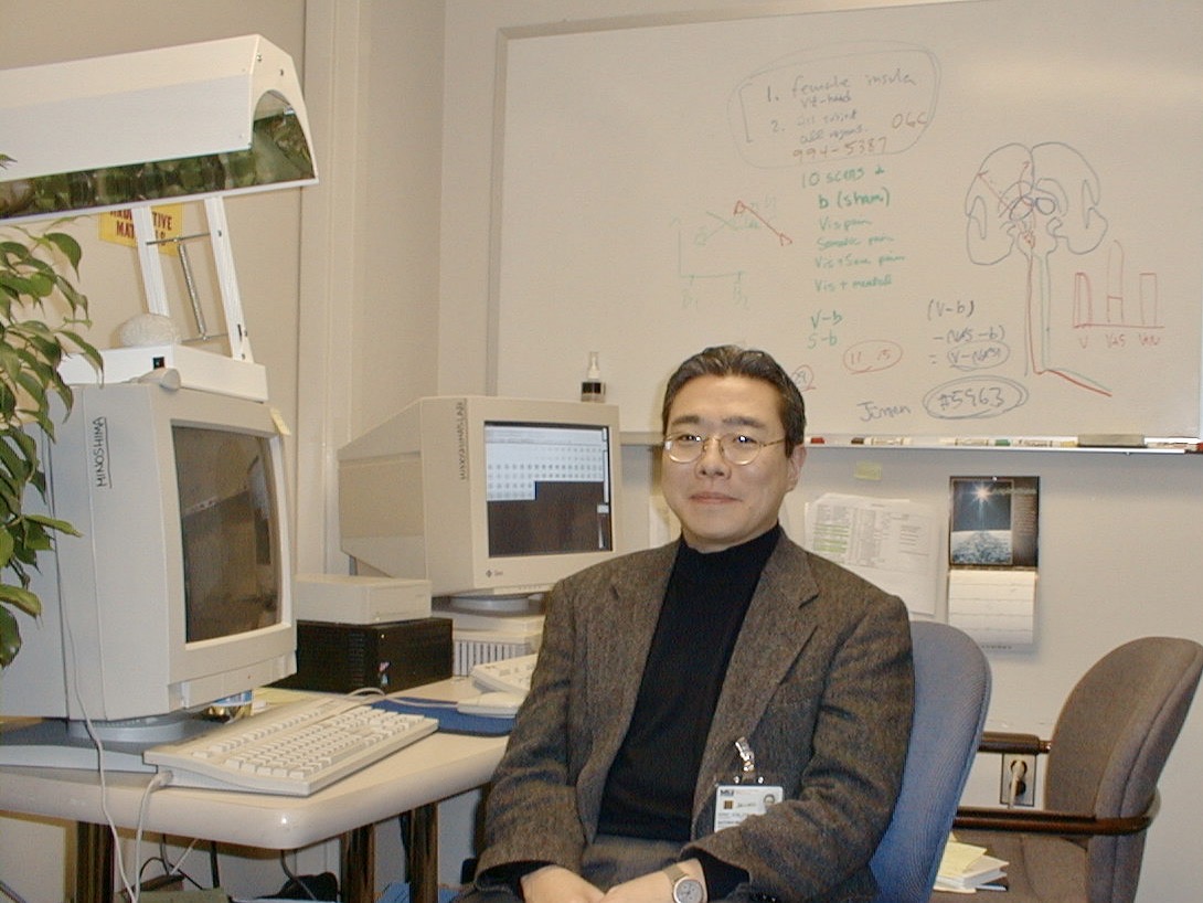 Satoshi Minoshima in his office in 1999